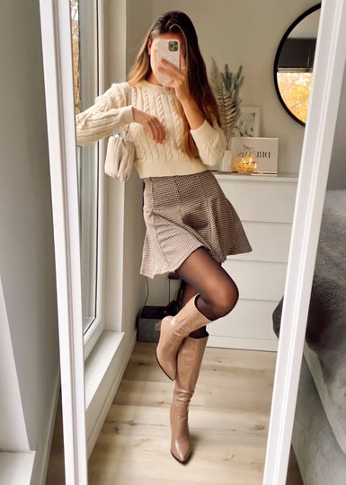 Fall outfit inspiration with pleated brown skirt, brown heels boots, and beige cropped sweater from Shein