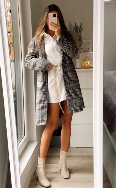 Autumn outfit. Sweetinstabella mirror selfie wearing white heels ankle boots, with white blouse dress from Shein and a grey plaid coat.  