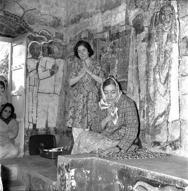 Mehera with Mani Irani ( standing ) and Roda Mistry viewing Meher Baba in the crypt on January 31st 1969. On the floor, the record player is playing "Begin the Beguine" by Hutch Hutchinson, this was played 7 times as per Baba's instructions.