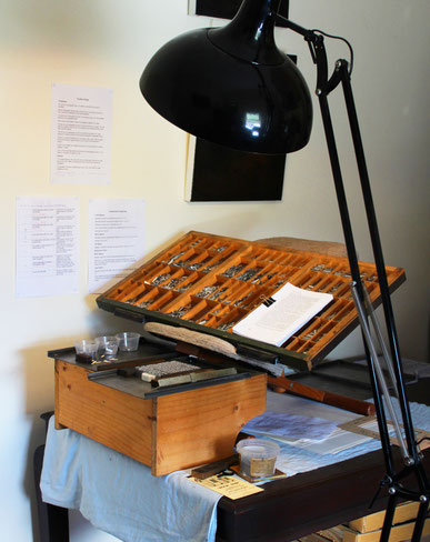 This is my home compositor’s rig, made up of my dining table, an old pine box, and a recommissioned ergonomic chair with my California Job Case on top—all set up to form a work stand.