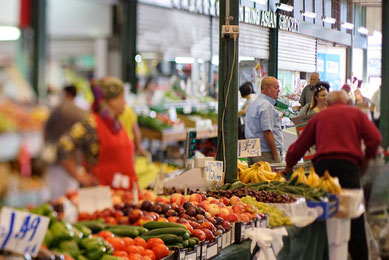 Man standing by fruits in the Preston Market