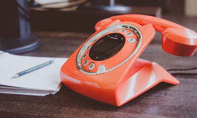 Tangerine coloured dial phone