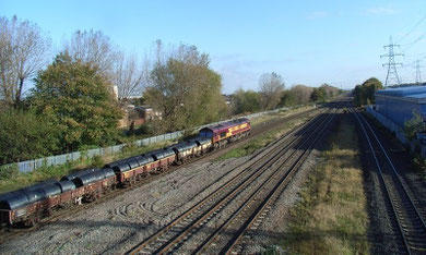 Castle Bromwich Station platform 2008 visible on the left beyond the train. Viewed from the site of the station building on the Chester Road bridge. The British Industries Fair buildings stood to left of the railway line.