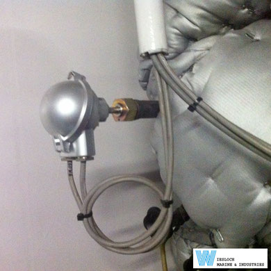 A PT100 temperature sensor installed in the engine room of a ship.