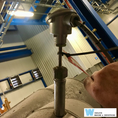A PT100 temperature sensor installed in a factory on a ship.