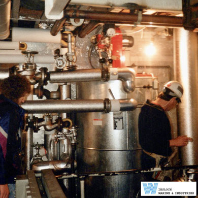 Service visit in the 1990s showing a Weishaupt burner installed on a Wiesloch thermal fluid heater.