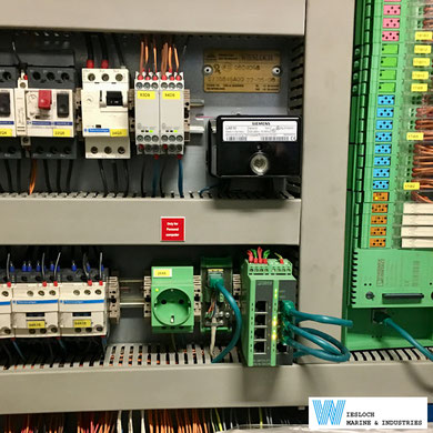 A Siemens LAE10 flame signal amplifier in a switch panel of a ship.