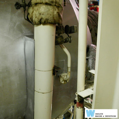 An ATH thermostat and a PT100 temperature sensor installed in the tubing going to the boiler in the engine room of a ship.