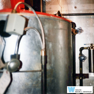 An ATH thermostat and a PT100 temperature sensor installed on an industrial boiler.