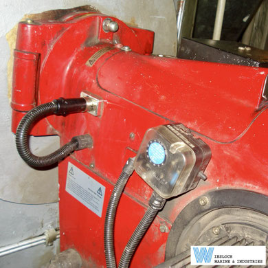 Weishaupt burner showing a Dungs pressure monitor and Siemens RAR9 flame sensor, photographed during a conversion project aboard an asphalt tanker.