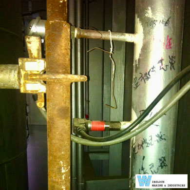 A PT100 temperature sensor installed in the piping on a ship.