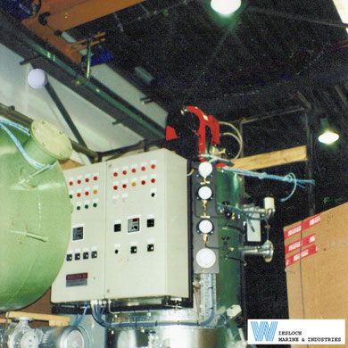 Factory-assembled Wiesloch thermal fluid heater fitted with a Weishaupt burner, with a control panel and two Wiesloch temperature controllers visible in the foreground.