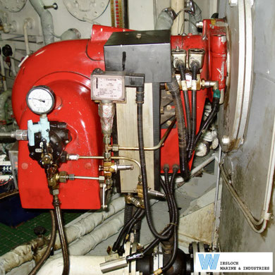 Weishaupt medium and heavy oil burner showing a Sauter DSA46 pressure switch, oil preheater and Suntec TA fuel pump, installed aboard an asphalt carrier during a conversion project.