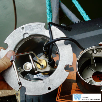 Weishaupt holder for combustion head P/N 211 153 0108/7, fitted with a nozzle head and ignition electrodes, photographed aboard a heavy cargo vessel.