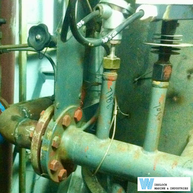 An ATH thermostat and a PT100 temperature sensor installed in the piping of a ship.