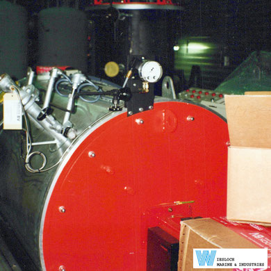 An industrial boiler being prepared for installation with two PT100 temperature sensors installed.