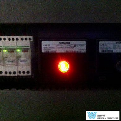 A Siemens LAE10 flame signal amplifier in a switch panel of a ship.