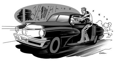 Doc Wilde rides the running board of his Tucker Torpedo