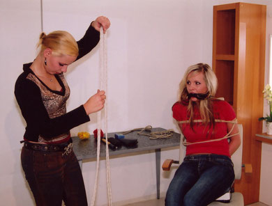 A terrified Amanda watches the mad Annika coming up with new horrible ideas how to make her suffer