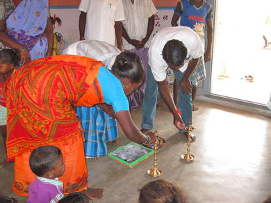 Irular village leader ligthen traditional lamps