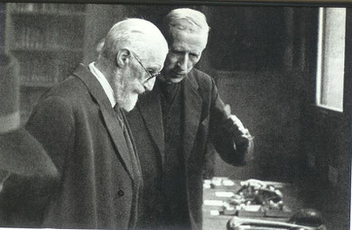 Pere Teilhard de Chardin and Lucien Cuenot examining fossils from the Far East, in the Institute of Human Palaeontology.