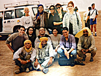 Travelers with their guide and drivers in the year 2000