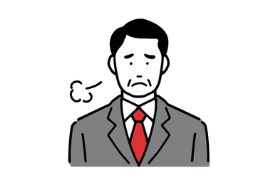 ため息をつく男性