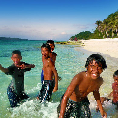 Get to know the locals! They're fun! At Puka Beach, Boracay, Philippines. 2013 © Sabrina Iovino | JustOneWayTicket.com