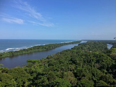 Travelers boarding a private shuttle offering hotel-to-hotel transportation between Tortuguero and La Fortuna.