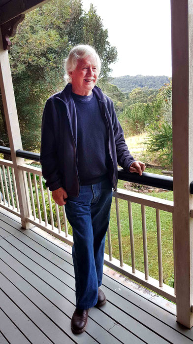 2016 : John at his home with Avatar's Abode in the distance. Photo taken by Anthony Zois
