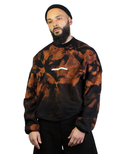 men wearing an oversize acid-washed black orange sweater