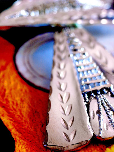 Prajapati: Triangular- sterling-silver-earrings, close up of rope-work and etched leaves on solid outer edges