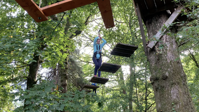 Susanne McCabe traverses an obstacle on the treetop course in Loch Lomond.