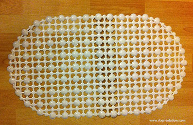 Tapis de douche troué