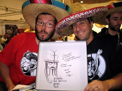 (A.Bauza en compagnie de l'illustrateur Pierô, tous deux coiffés du traditionnel sombrero de l'éditeur Repos Prod) / crédit photo : www.jeuxnco.org