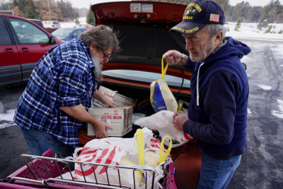 Getting ready by unloading generous donations.  