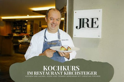 Kochkurs im Restaurant Kirchsteiger in Völlan mit Küchenchef Christian Pircher, der ein Gericht präsentiert, im stilvollen Innenbereich mit IRE-Auszeichnung