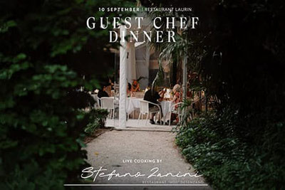 Guest Chef Dinner al ristorante Laurin il 10 settembre con live cooking di Stefano Zanini, cena suggestiva nell'atmosfera del giardino.