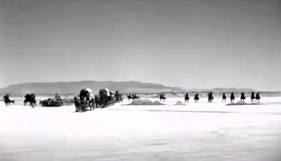 The lobby card to John Wayne's "Westward Ho" shows a section of the Lone Pine locations only sometimes used for desert scenes. 