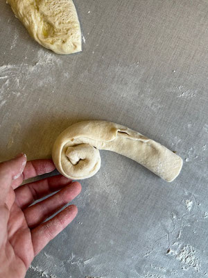 zu einer Schnecke aufrollen