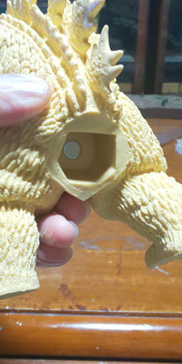 Magnet embedded at the base of the tail