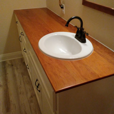 Custom Bathroom Cabinet with solid Cherry wood countertop.