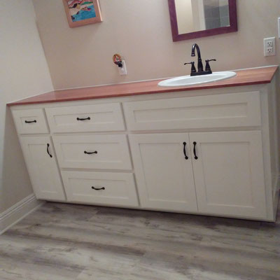 Custom Bathroom Cabinet with solid Cherry wood countertop.