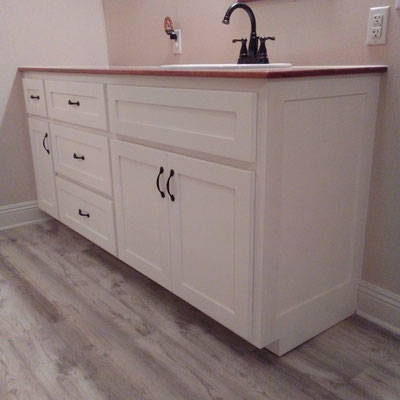 Custom Bathroom Cabinet with solid Cherry wood countertop.