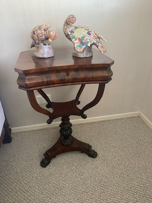 Mahogany pedestal sewing table with serpentine shaped top acanthus leave pedestal resting on tripod base with loin claw feet Circa 1850 $ 2100