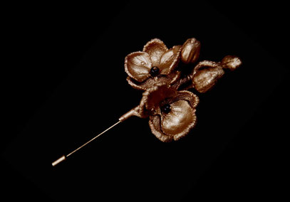 Orchid broach, gilded copper and garnets