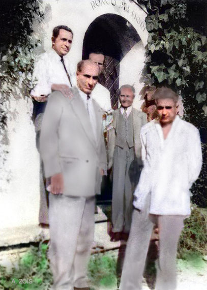 Some of the men mandali at the entrance of Hedi Merten's residency in Locarno, where some of them stayed. Image colourized by Anthony Zois.