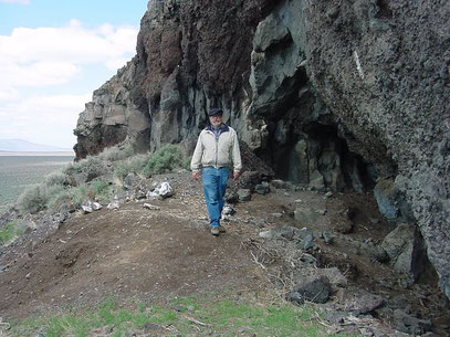 “Paisley Caves, above the Summer lake plain, Oregon. In these caves some of the oldest human remains in North America were found. Bill Cannon, archaeologist of the BLM Lakeview, district in the center.” Photo from Wikimedia Commons.