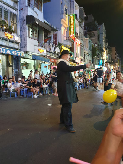 man with a snake in vietnam saigon ho chi minh city