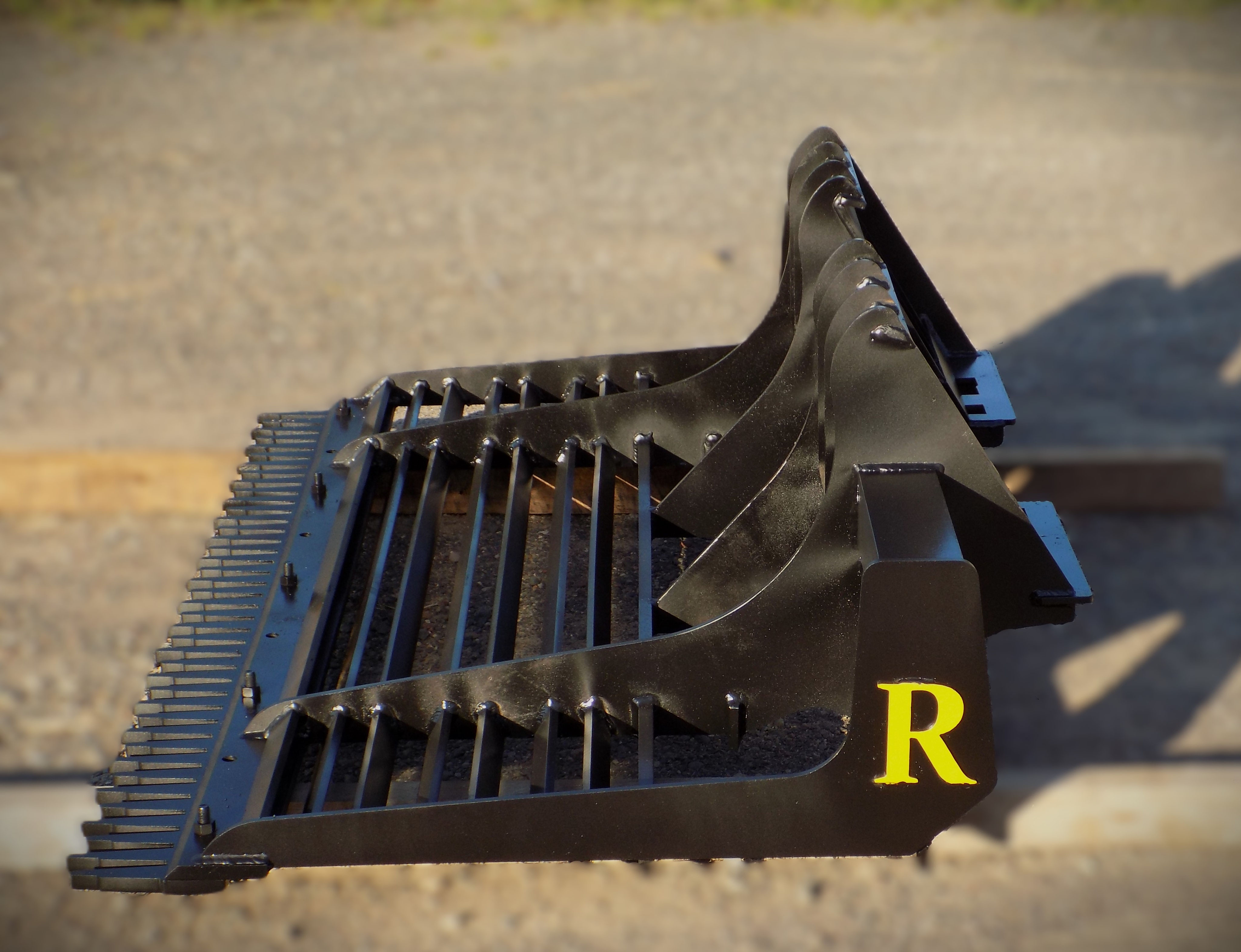 Skid Steer Attachments Raveling Companies, LLC